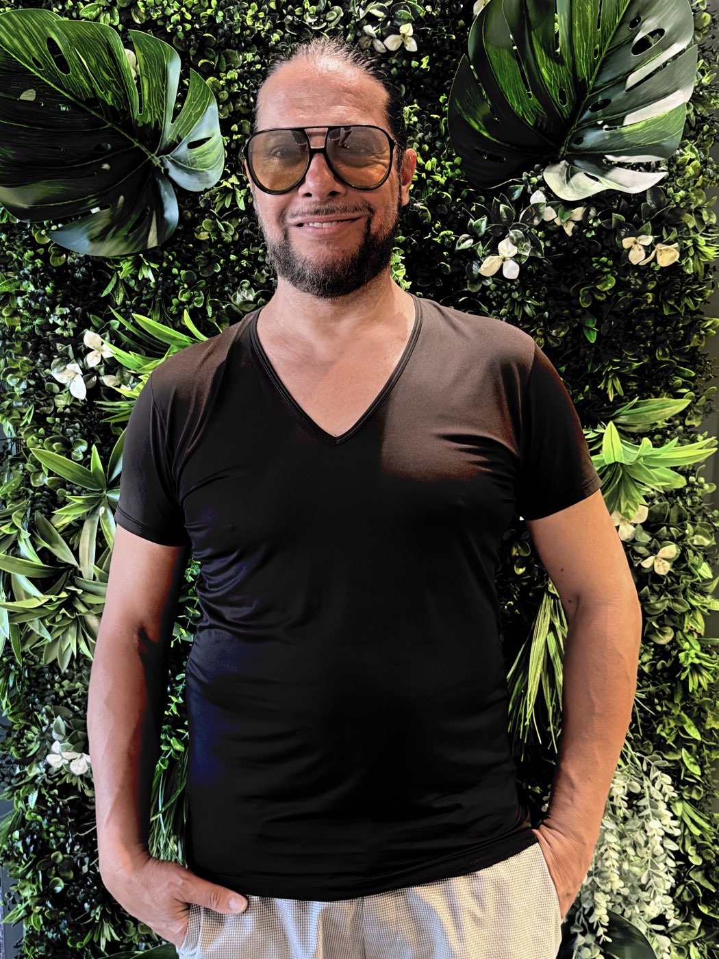 Joaquín Cortés in front of the resort's vertical garden