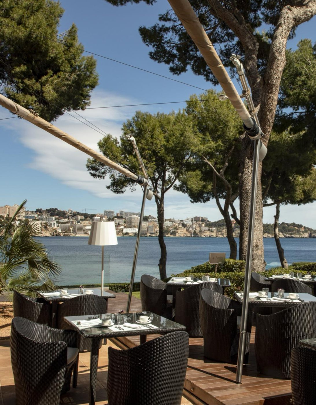 The terrace over the bay, set for dinner